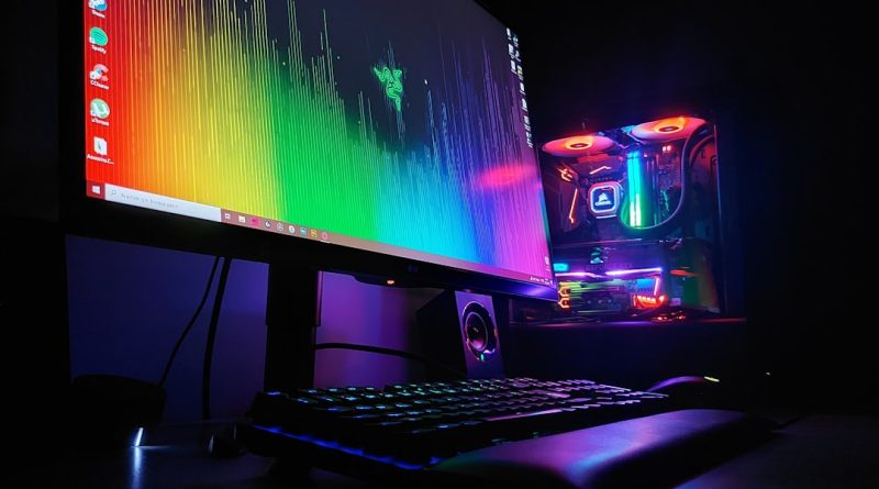black flat screen computer monitor turned on beside black computer keyboard