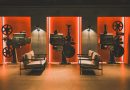 A cozy retro cinema room showcasing vintage film projectors and comfortable seating.