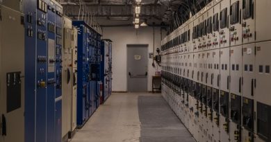A sophisticated control room filled with electrical panels and equipment for industrial purposes.