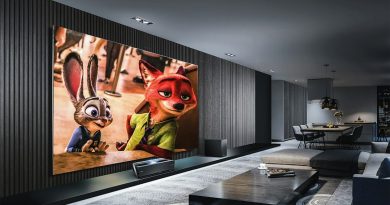 A large screen displaying an animated rabbit and fox in a modern living room